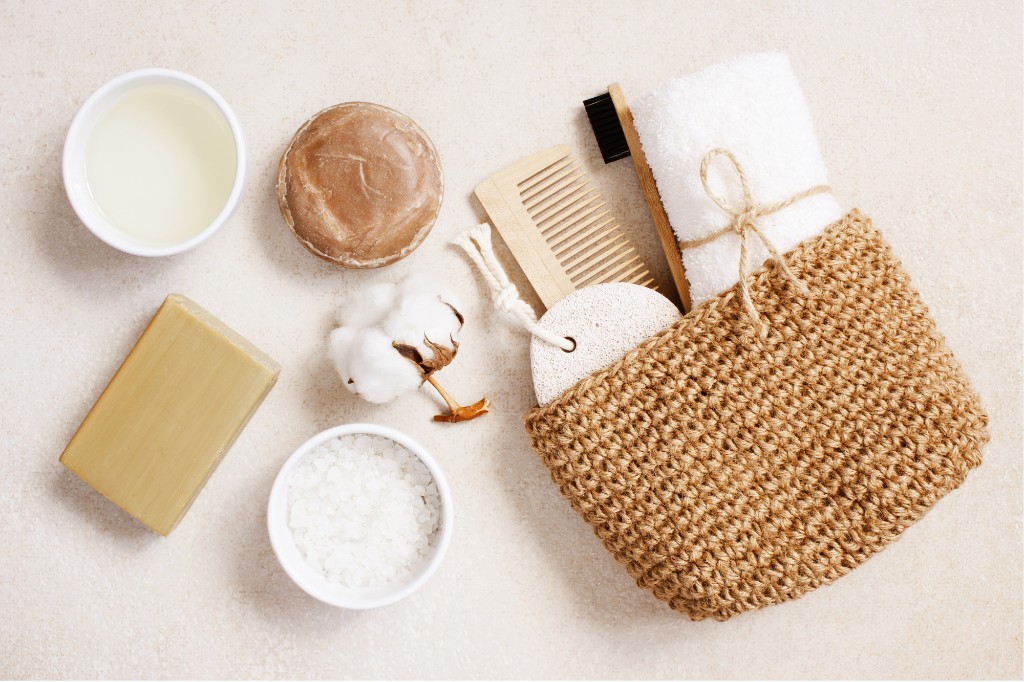 Flat-lay of natural soaps, salts, and tactile bathroom essentials