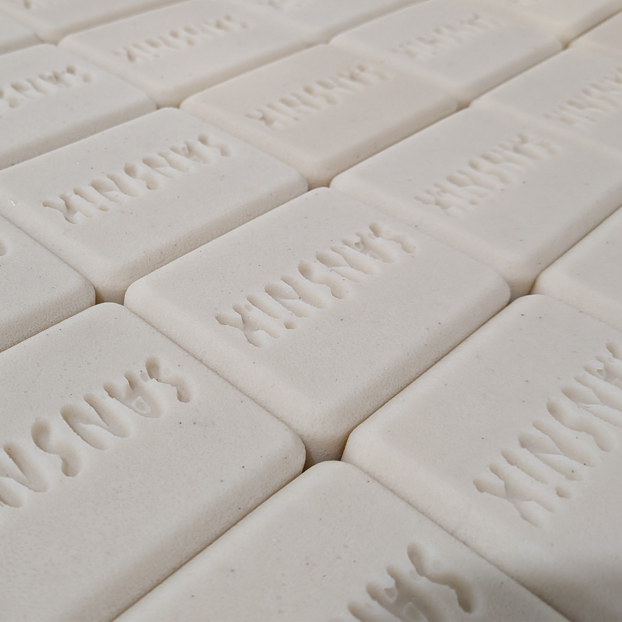 Two Contour Bars on a marble surface
